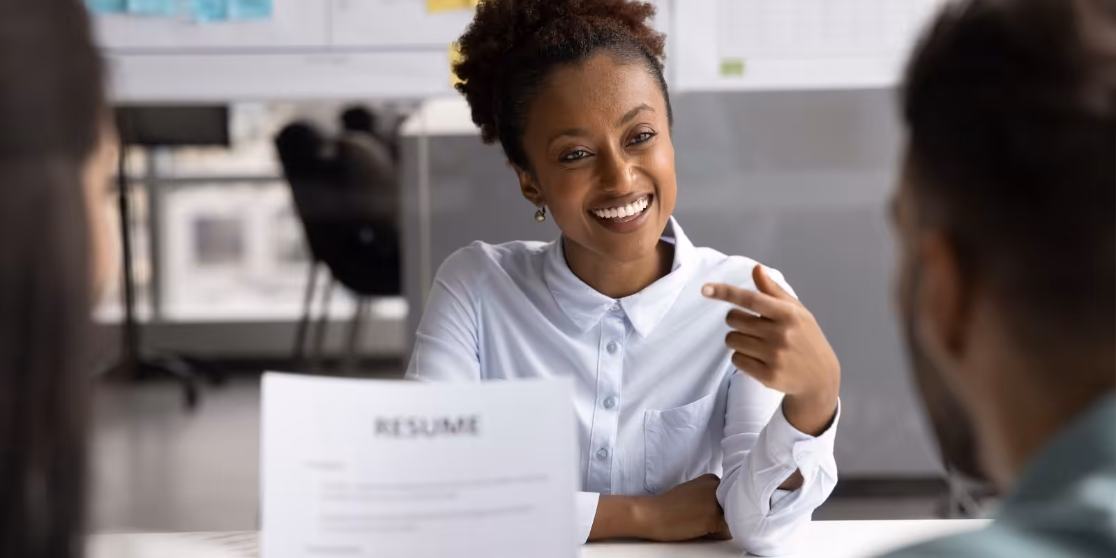 Woman in a job interview — navigating a career and coverage transition